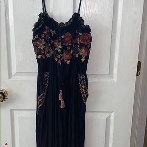 black romper with embroidered flowers